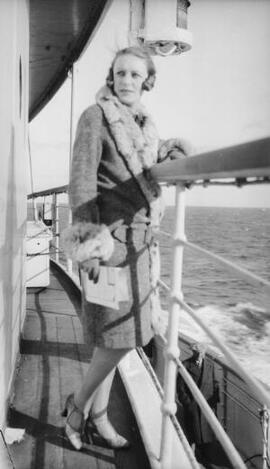 [Unknown lady wearing fur trimmed coat on board a ship]