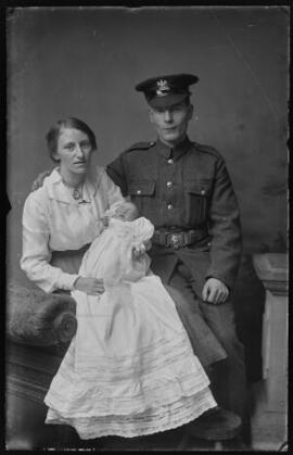 [Soldier in the Labour Corps with his wife and baby].