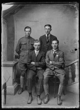 [Soldier and three civilians]