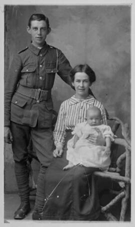 [Soldier with wife and child]