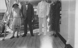 [David, Margaret and Megan Lloyd George with a ships captain]