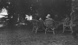 [Lloyd George entourage sitting in a garden]