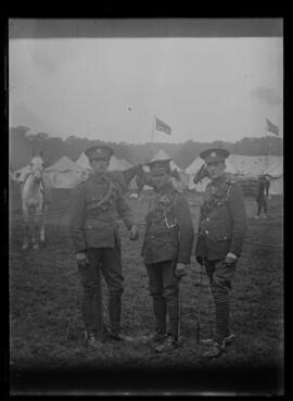 [Three soldiers in the Pembroke Yeomanry photographed at a military camp]