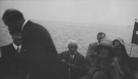 [David and Gwilym Lloyd George, Inspector Pavey and others in a boat]