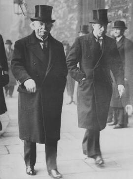[David Lloyd George and A. J. Sylvester wearing coats and top hats]