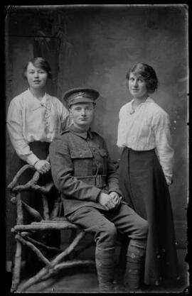 [Private, Monmouthshire Regiment with two young ladies]