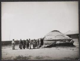 [Group standing next to a yurt]