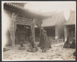 [Monks outside the temple]