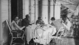 [David, Margaret and Gwilym Lloyd George with two other ladies at a table outside a Hotel, Geneva]
