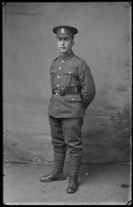 [Full-length studio portrait of a soldier in the Welsh Regiment]