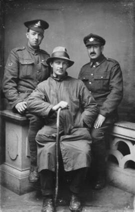 [Two soldiers and a civilian]