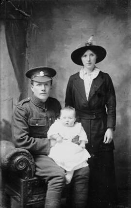 [Soldier, wife and child]