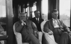 [David Lloyd George and two men in a railway carriage]