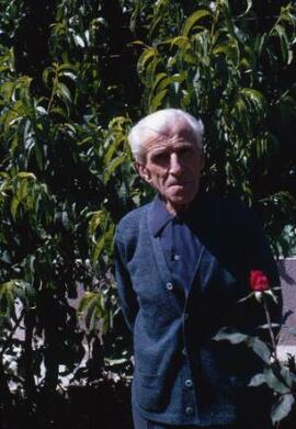 [Portrait of an elderly man in his garden]