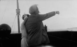 [David and Megan Lloyd George on the bridge of a ship]