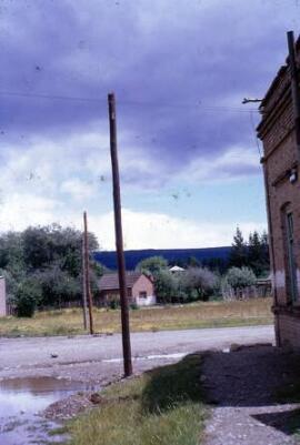 [Street with telephone poles, probably Trevelin]
